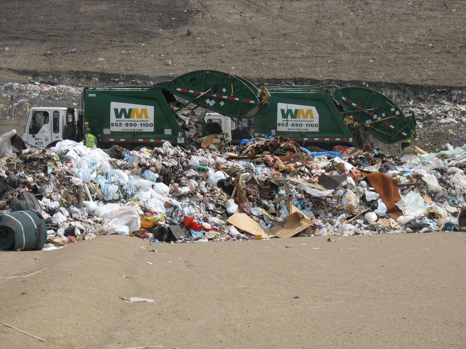 Dump trucks at landfill
